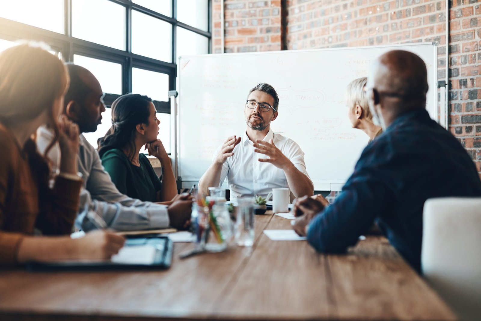 Leaders in conversation around a table